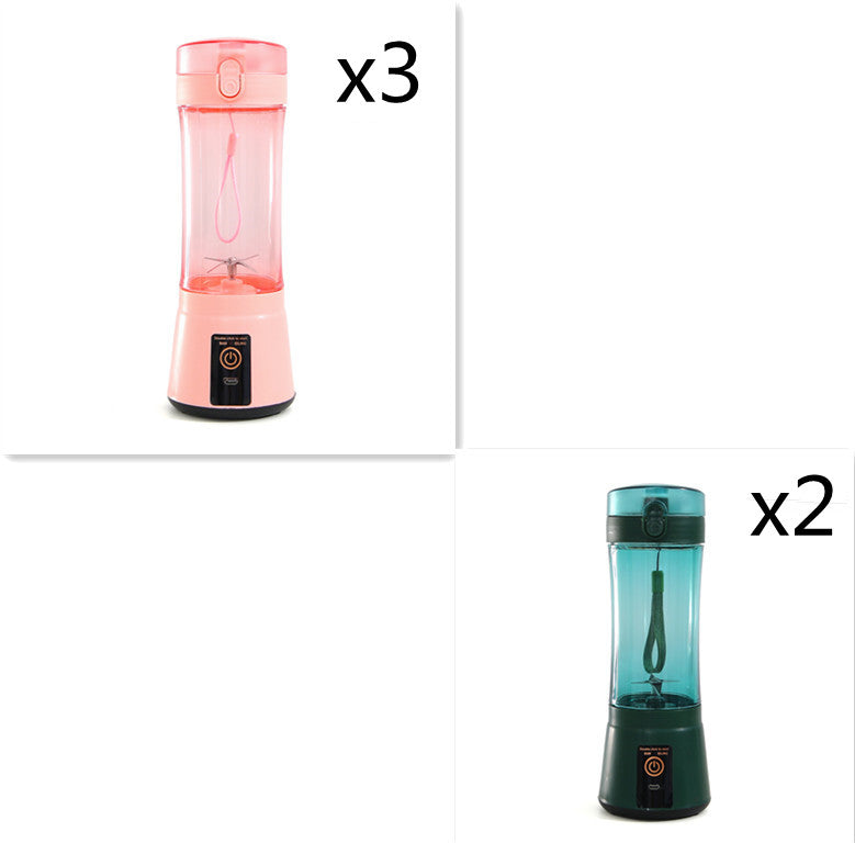 Portable electric fruit juicer with pink blender cup and teal blender cup