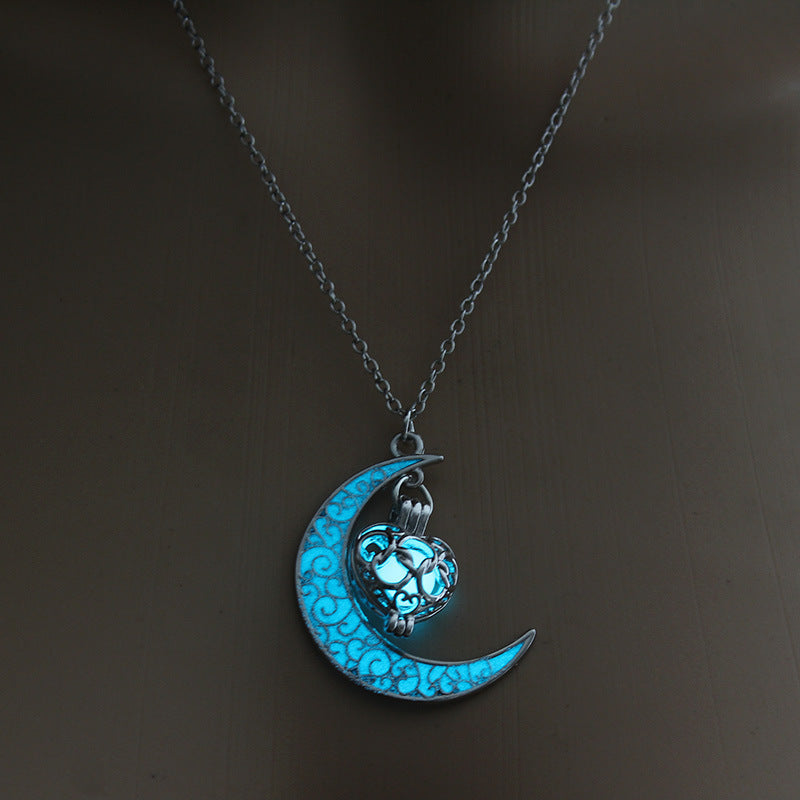 Glowing blue moon pendant necklace with cat lantern charm on silver chain