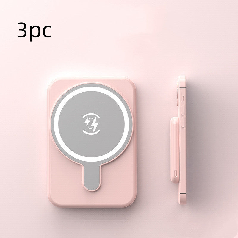 Set of three pink mini magnetic wireless power banks with charging icon