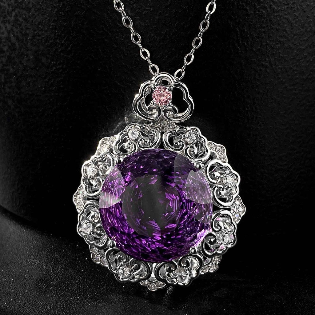 Silver amethyst pendant necklace with ornate filigree oval purple stone