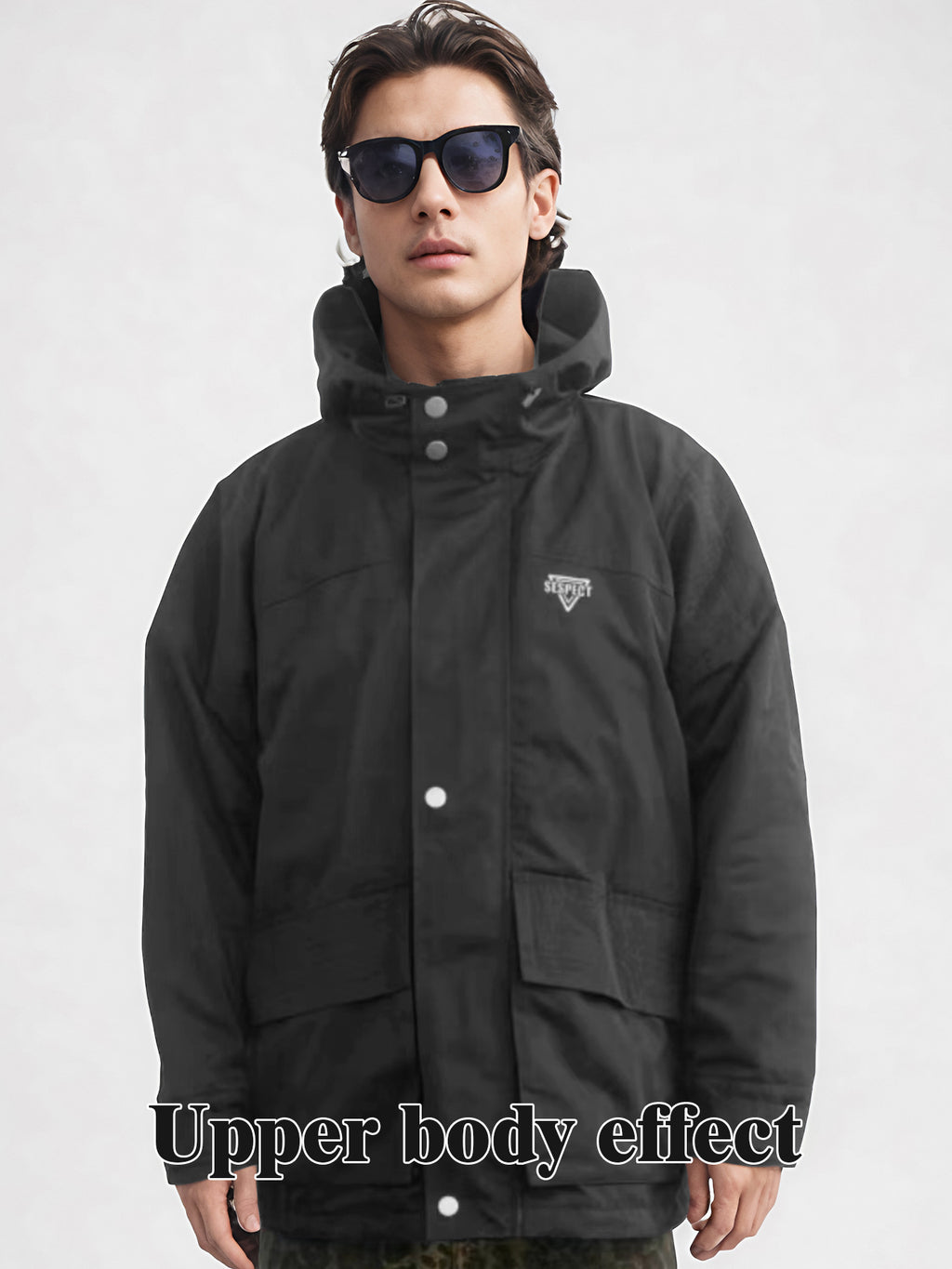 Black hooded rain jacket front view with snap buttons and chest logo patch