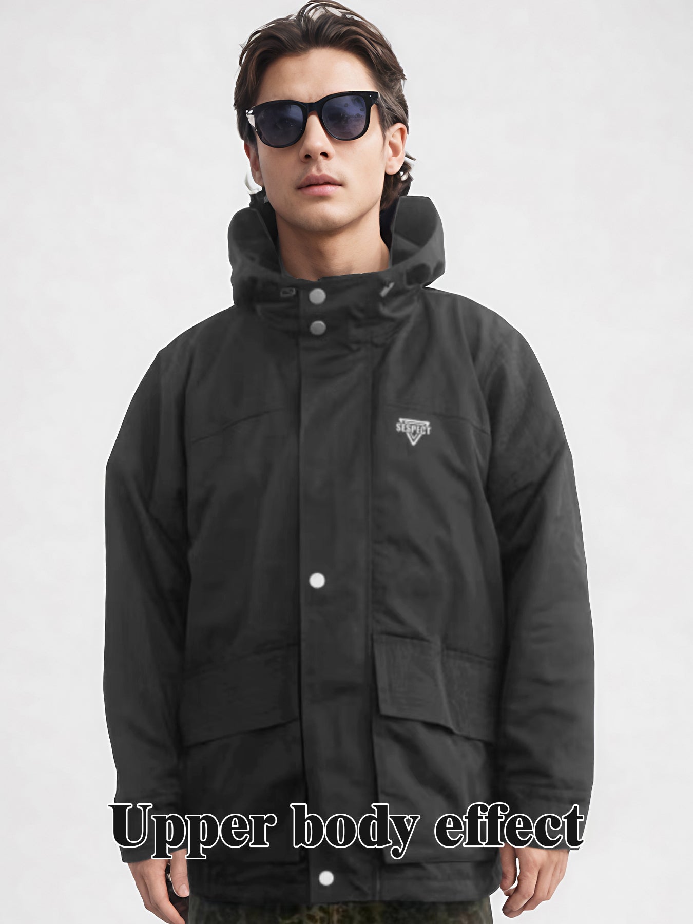 Black hooded rain jacket front view with snap buttons and chest logo patch