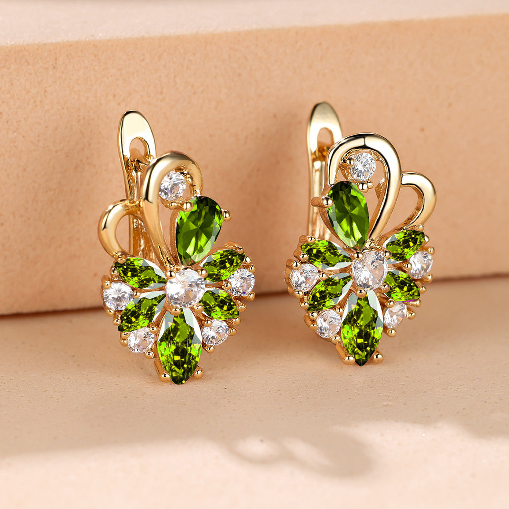 Gold-tone drop earrings with green marquise stones and clear round accents