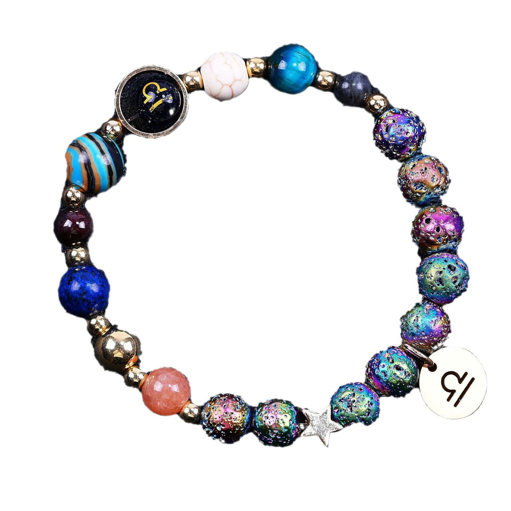 Beaded bracelet with multicolor speckled beads, star charm, zodiac disc, blue and white beads.