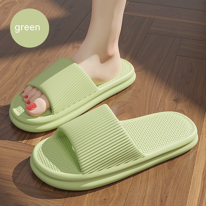 Green striped slip-on home slippers with textured sole and open toe