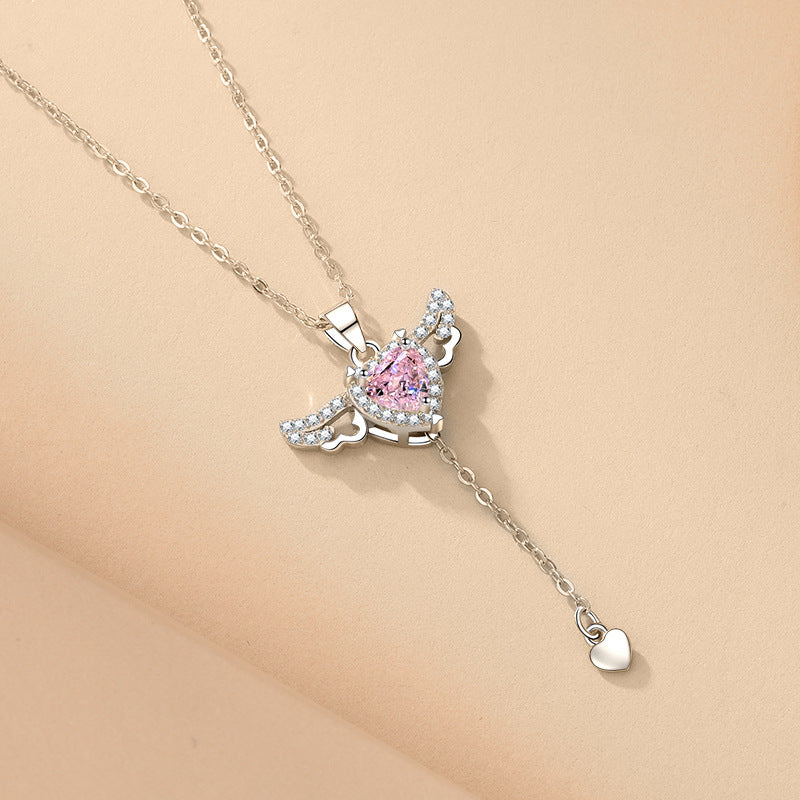 Silver-toned angel wing heart necklace with pink crystal triangle pendant and heart drop