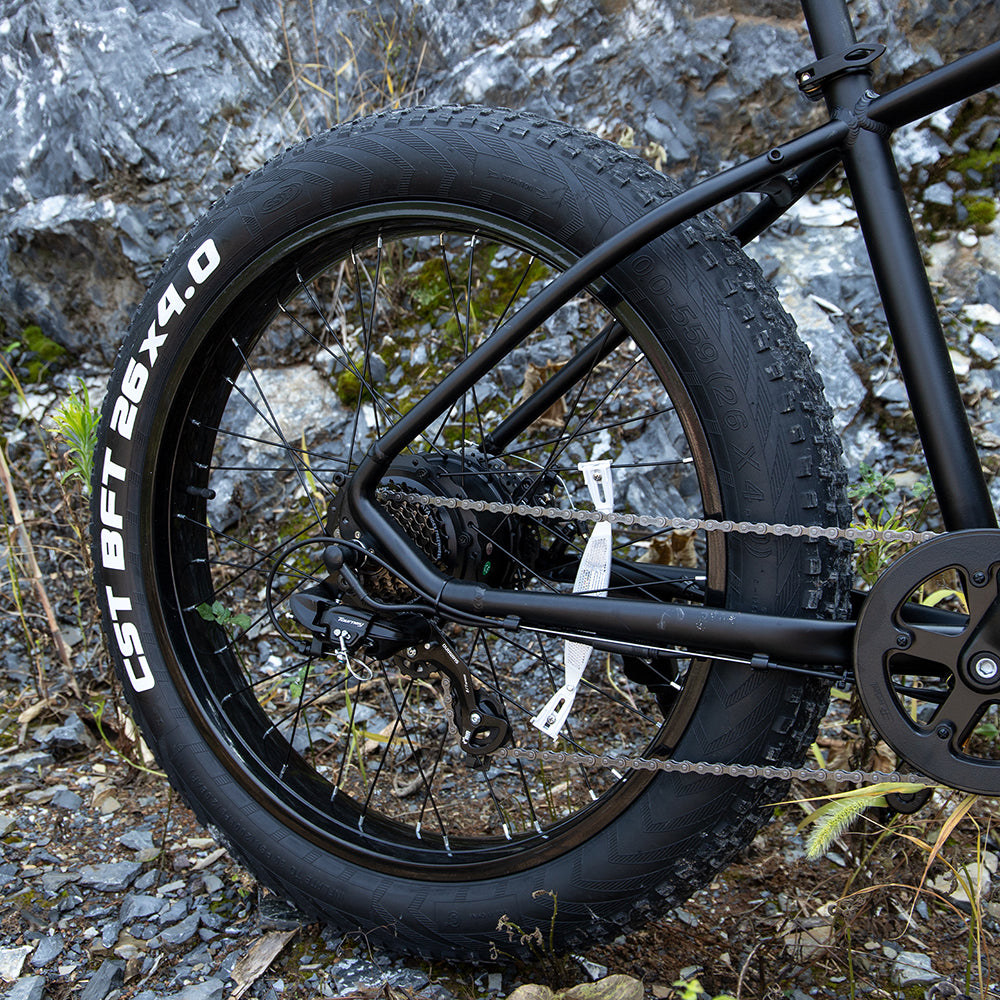 Black fat-tire e-bike front wheel with disc brake and treaded 26x4.0 tire