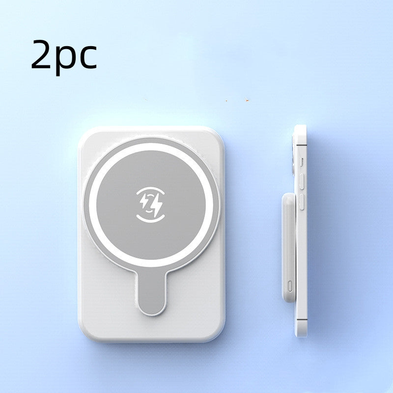 Set of two white mini magnetic wireless power banks with charging icon