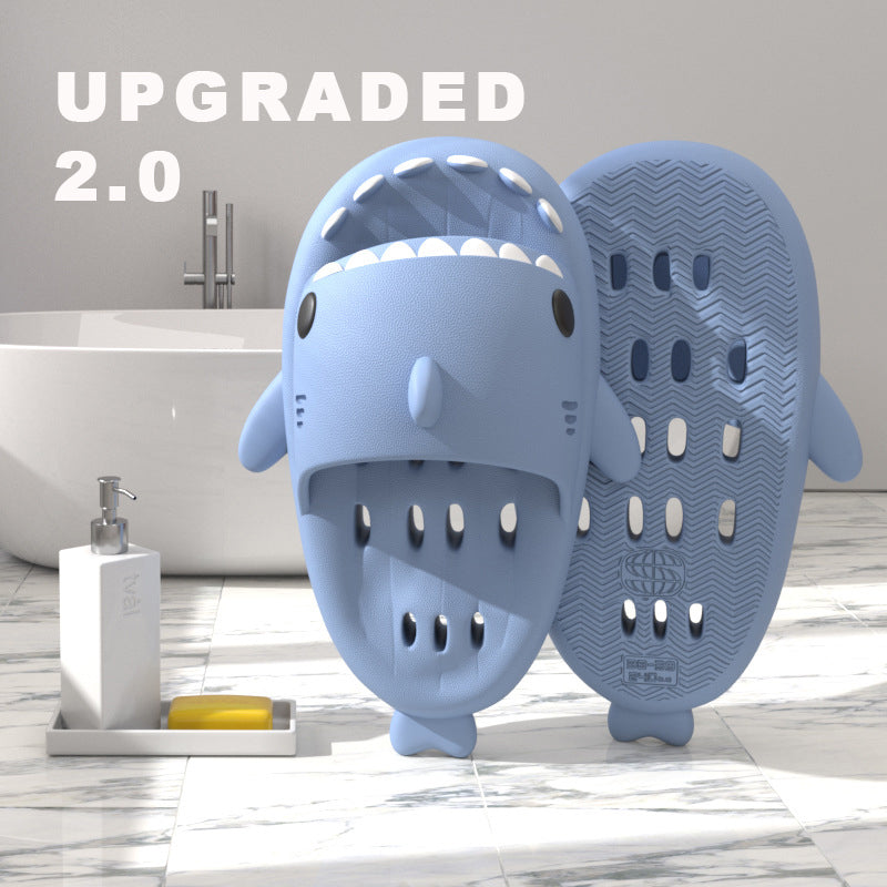 Blue shark-shaped EVA shower slide with drainage holes and grippy sole