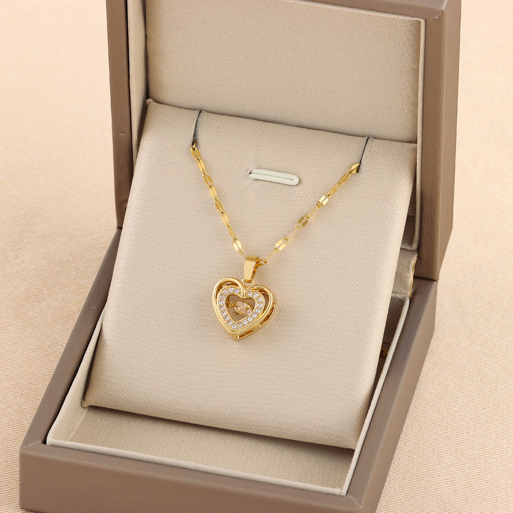 Double-layer love necklace with gold-toned heart pendant, shown in jewelry box