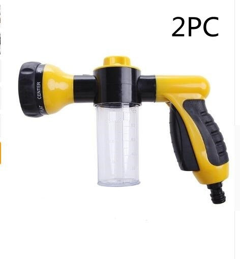 Foam spray gun with yellow-and-black body and clear bottle reservoir